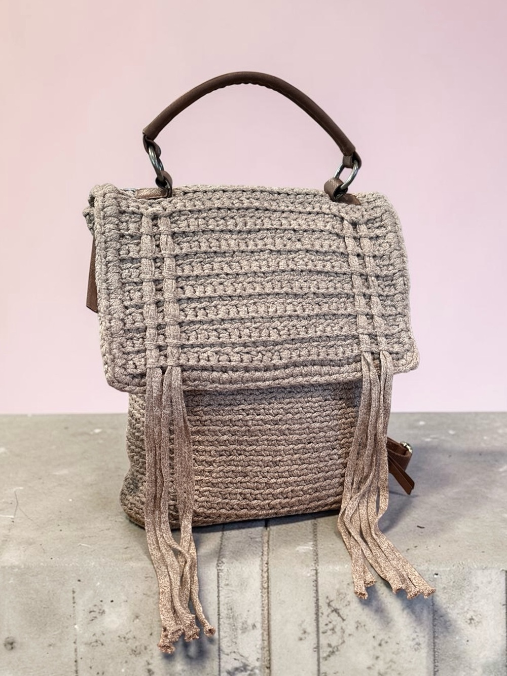 The Sak Helena Crochet Backpack in Taupe, with Fringe and Leather